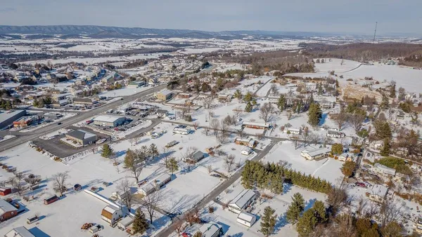 an aerial view of residential building and parking space