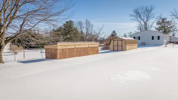 a view of a house with a snow in front of it
