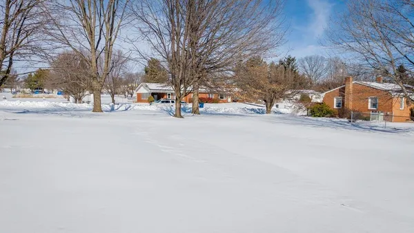 a view of road with a building in the background