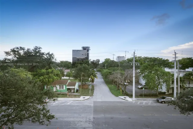 a view of a house with a street