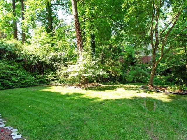 2723 Fairview Road Raleigh, NC 27608 - Photo 12 of 12 a view of a trees with a yard