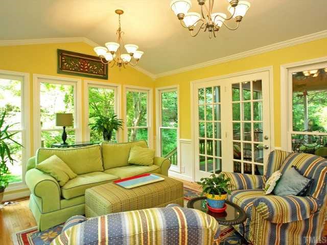 2723 Fairview Road Raleigh, NC 27608 - Photo 6 of 12 a bedroom with furniture and a large window