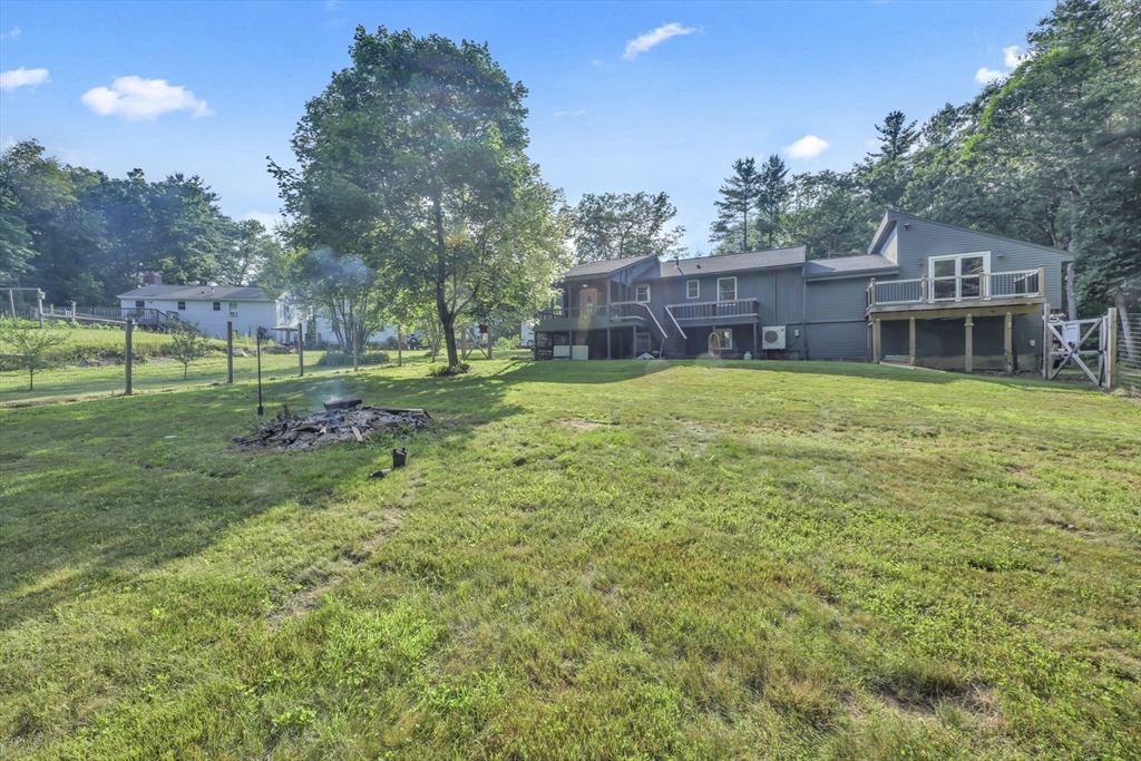 65 Breakneck Road Sturbridge, MA 01566 - Photo 34 of 42 a backyard of a house with barbeque oven