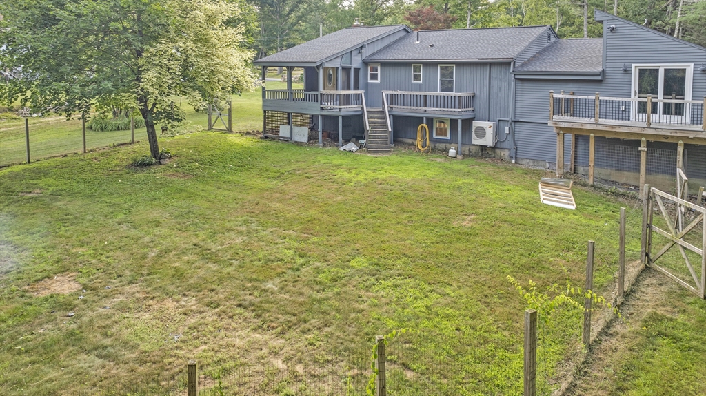 65 Breakneck Road Sturbridge, MA 01566 - Photo 41 of 42 a view of a house with a yard and sitting area