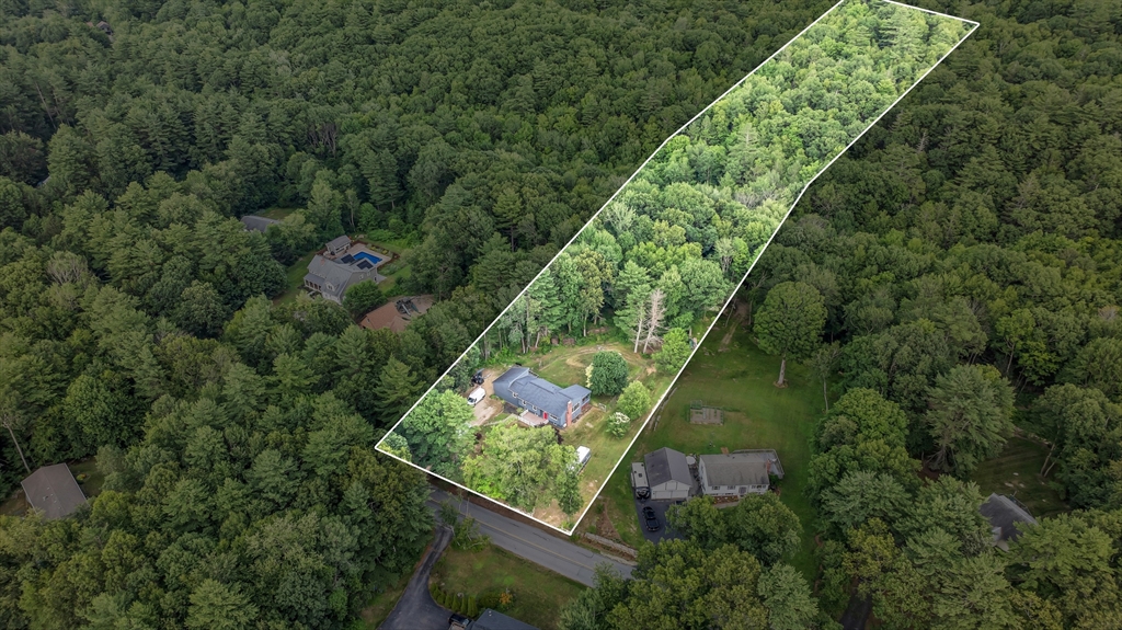65 Breakneck Road Sturbridge, MA 01566 - Photo 42 of 42 an aerial view of residential house with outdoor space and trees all around