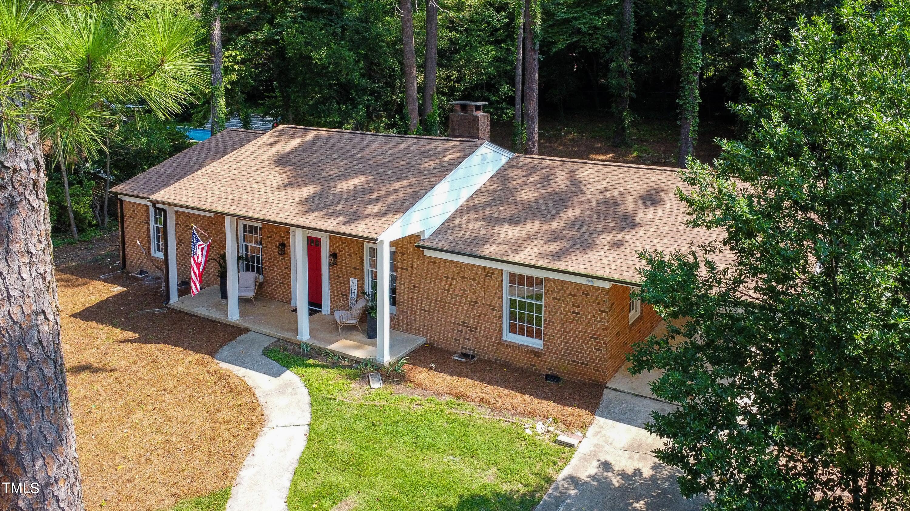 3512 Swift Drive Raleigh, NC 27606 - Photo 3 of 35 a backyard of a house with barbeque oven and outdoor seating