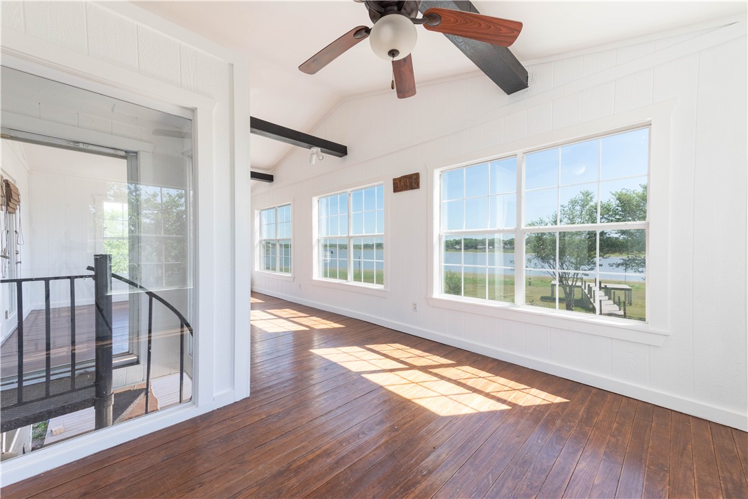 132 Zenna Drive Mathis, TX 78368 - Photo 19 of 40 a view of an empty room with wooden floor and a window