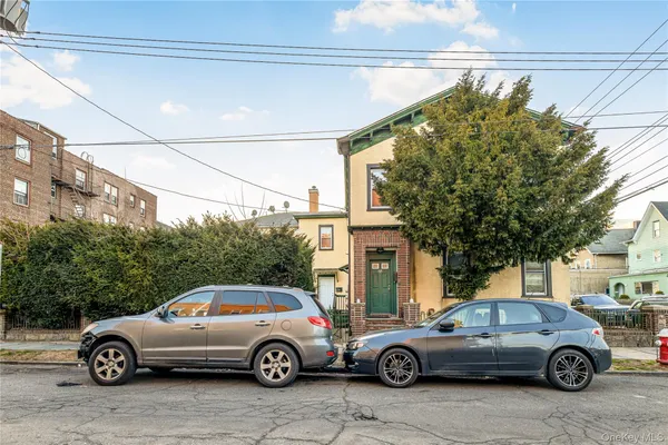 a front view of a house with parking space