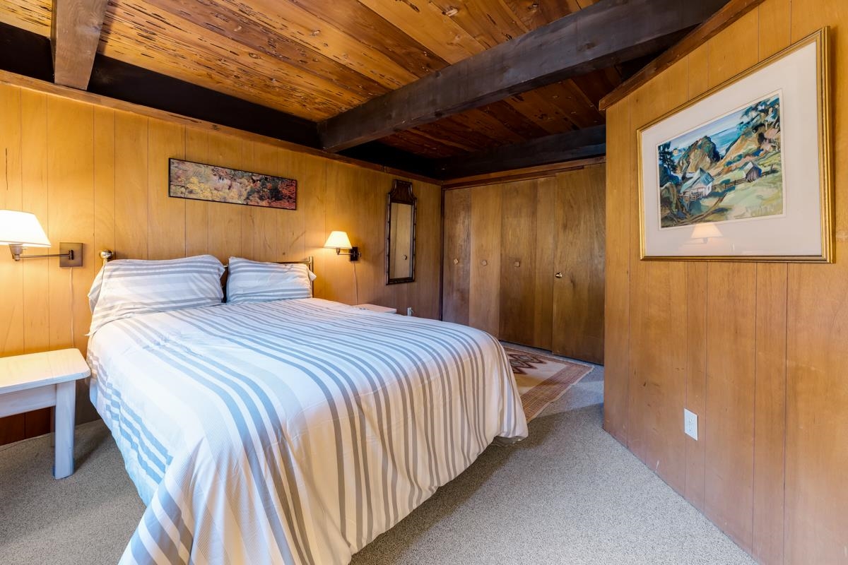 1650 Upper Bench Road Alpine Meadows, CA 96146 - Photo 12 of 21 a bedroom with a bed and a painting on the wall