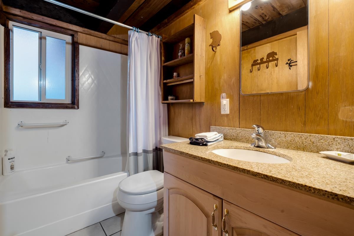 1650 Upper Bench Road Alpine Meadows, CA 96146 - Photo 14 of 21 a bathroom with a granite countertop sink toilet and shower