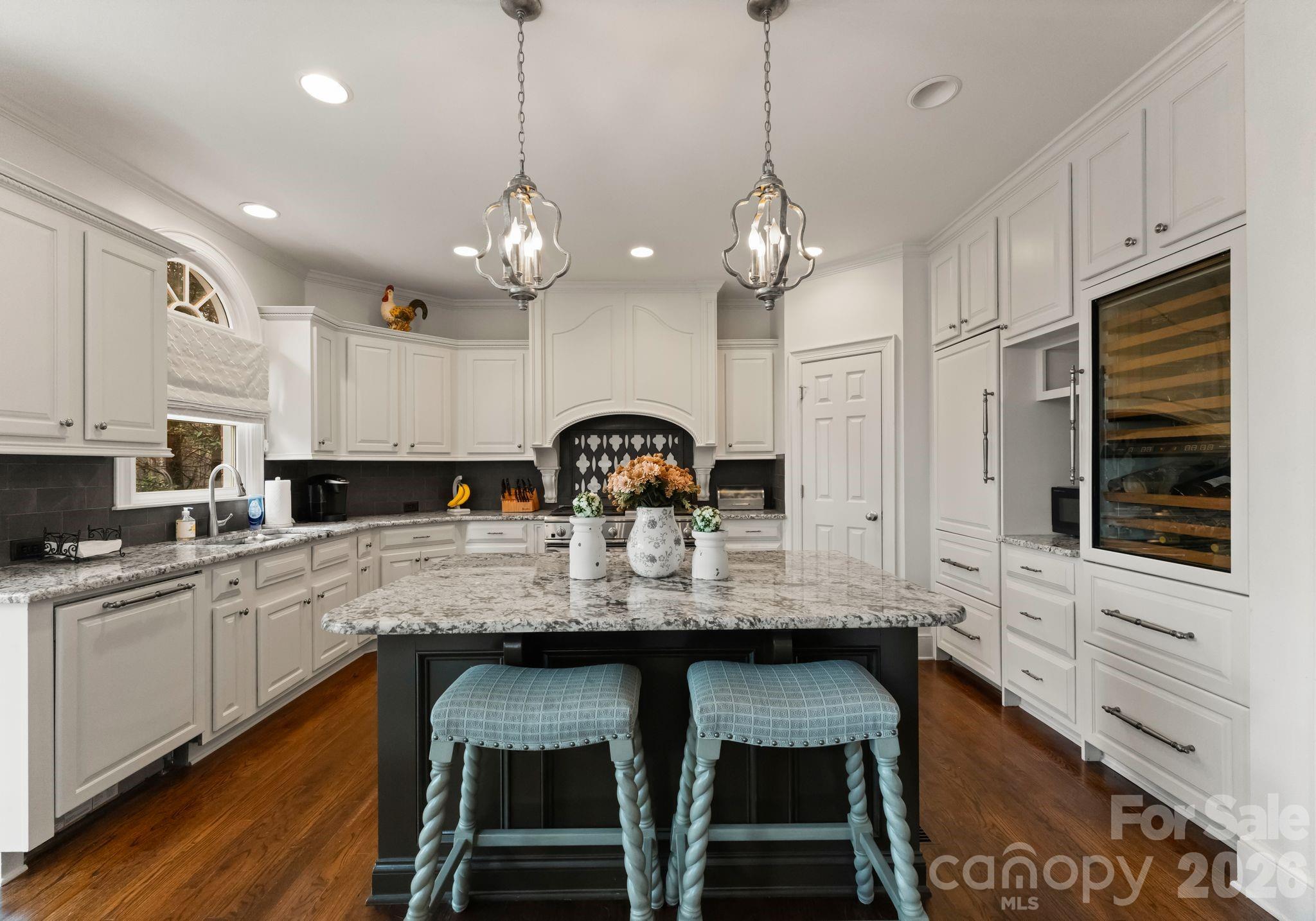 15705 Knox Hill Road Huntersville, NC 28078 - Photo 11 of 48 a large kitchen with granite countertop lots of counter space and stainless steel appliances
