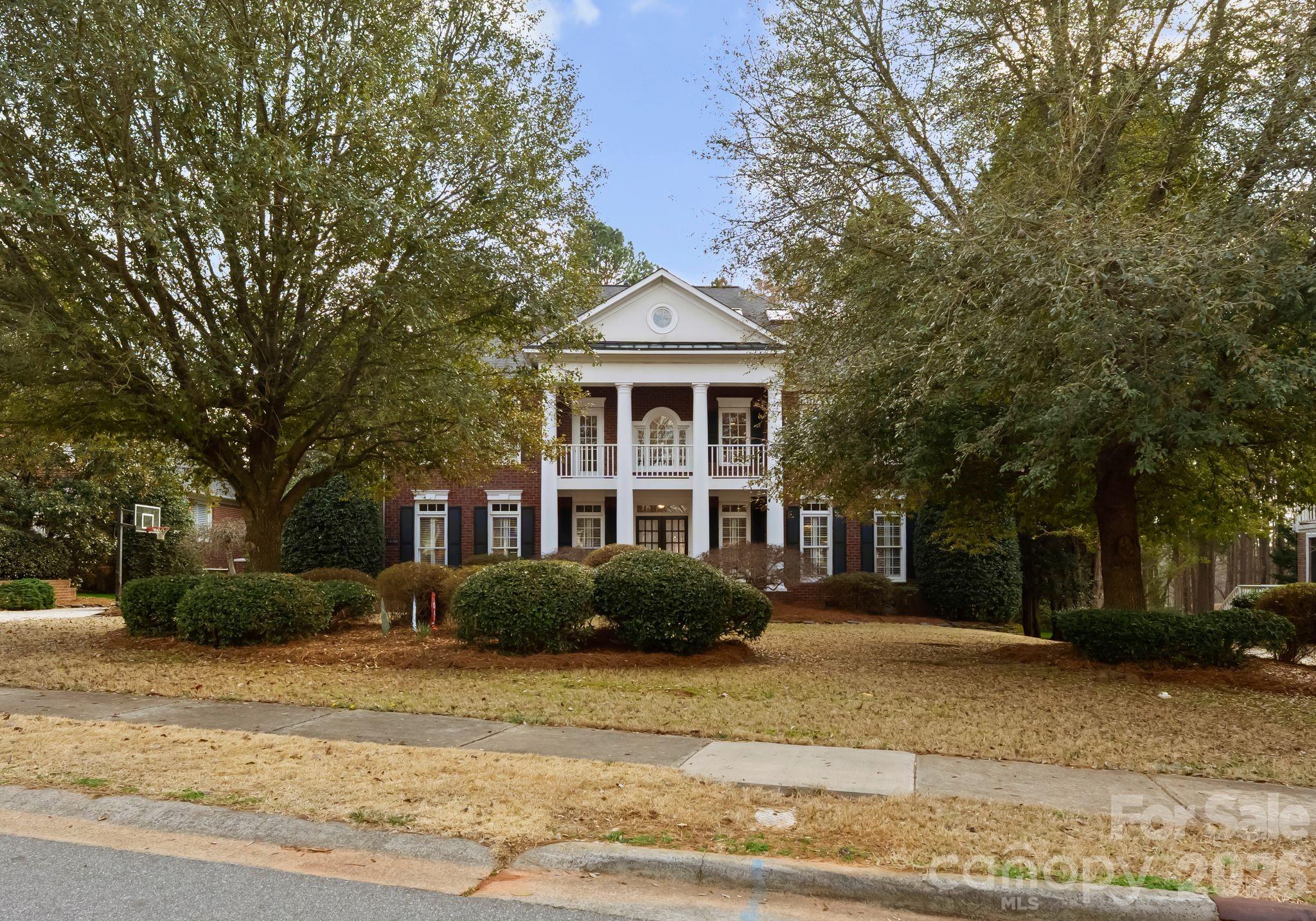 15705 Knox Hill Road Huntersville, NC 28078 - Photo 2 of 48 a front view of a house with a garden