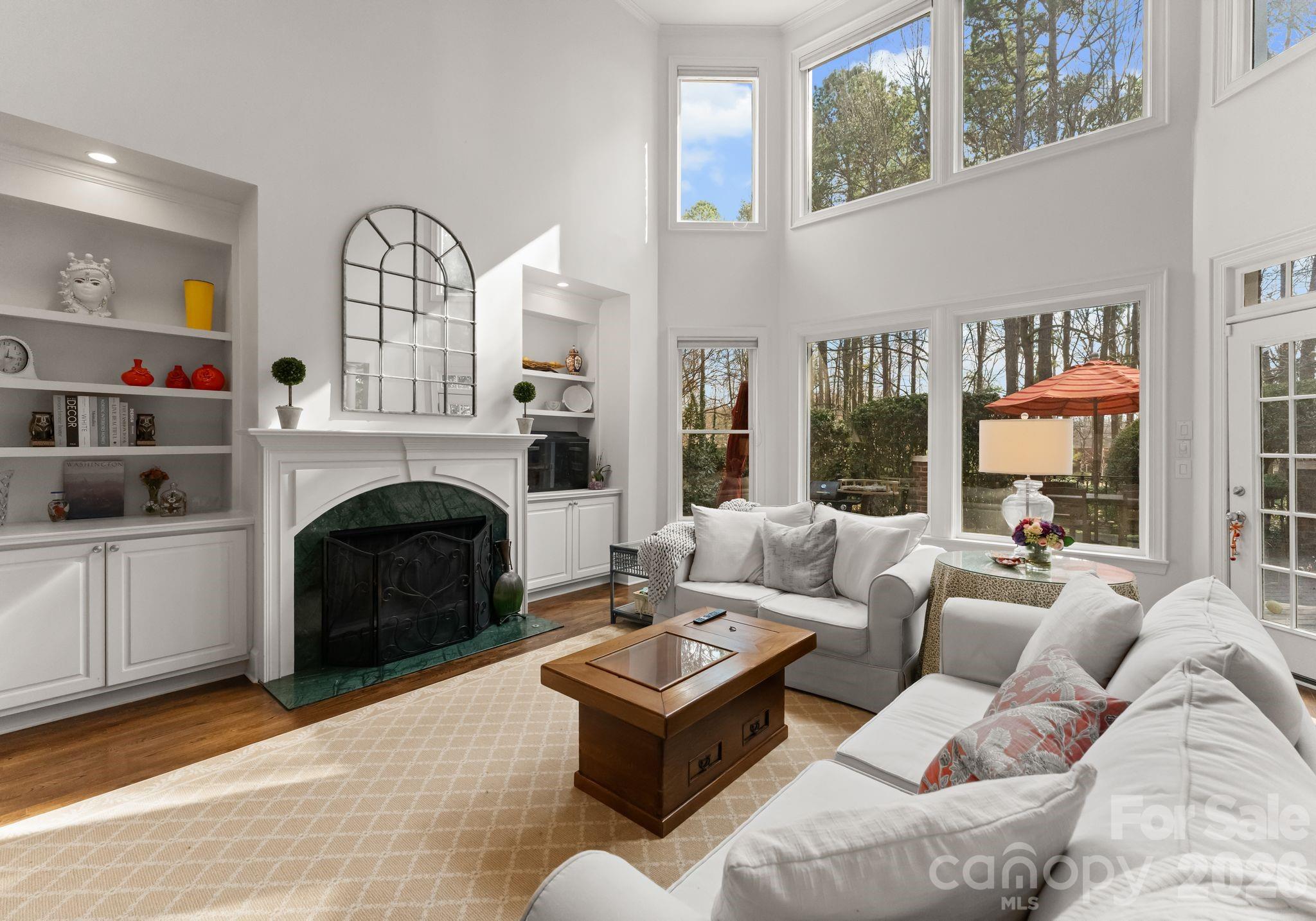 15705 Knox Hill Road Huntersville, NC 28078 - Photo 21 of 48 a living room with furniture a large window and a fireplace
