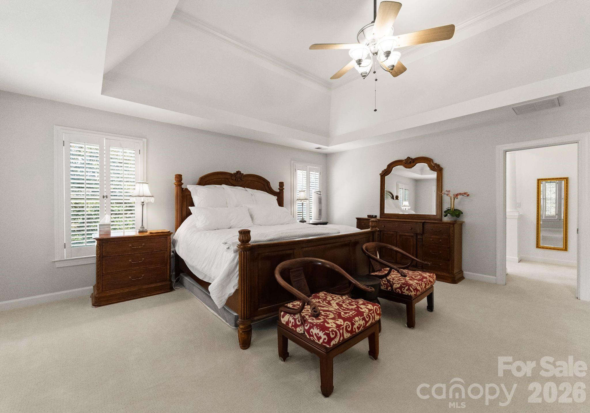 15705 Knox Hill Road Huntersville, NC 28078 - Photo 24 of 48 a spacious bedroom with furniture and windows