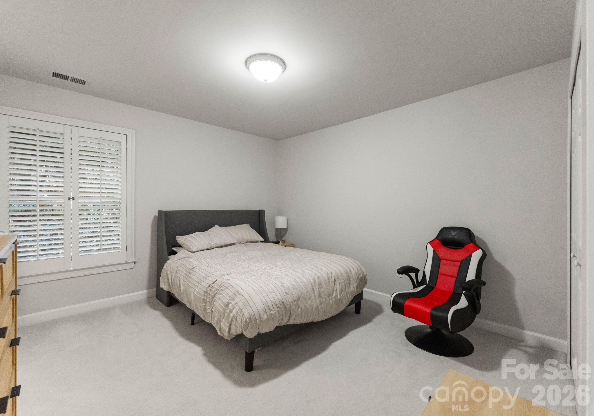 15705 Knox Hill Road Huntersville, NC 28078 - Photo 30 of 48 a bedroom with a bed and window