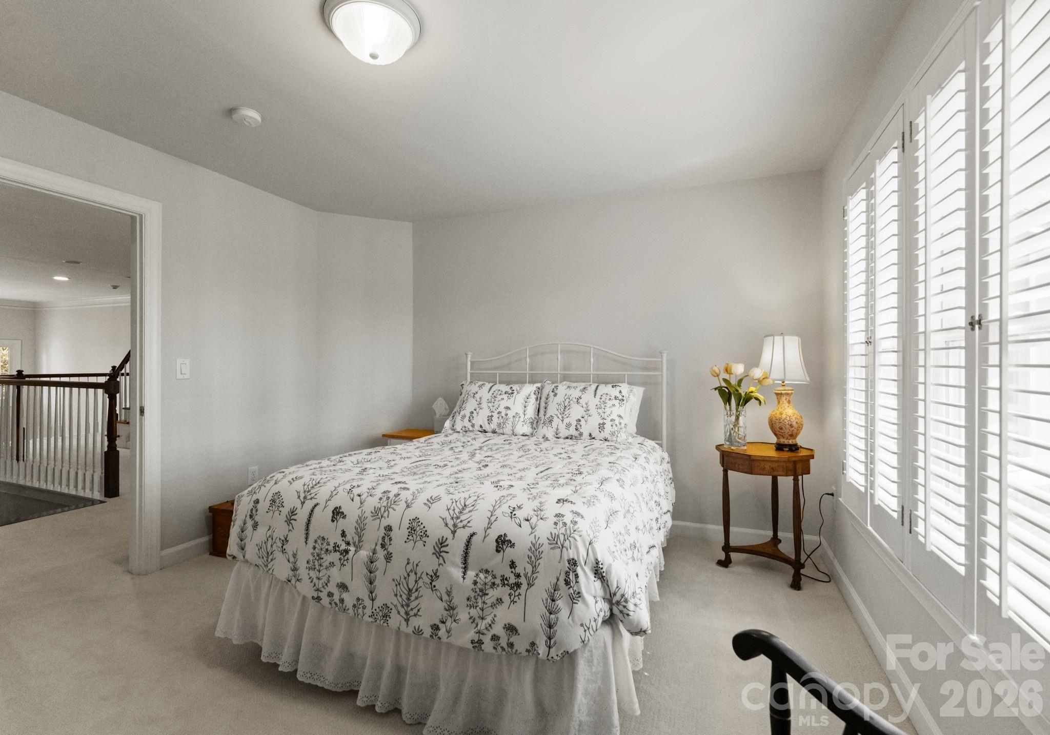 15705 Knox Hill Road Huntersville, NC 28078 - Photo 34 of 48 a bedroom with a bed and a lamp