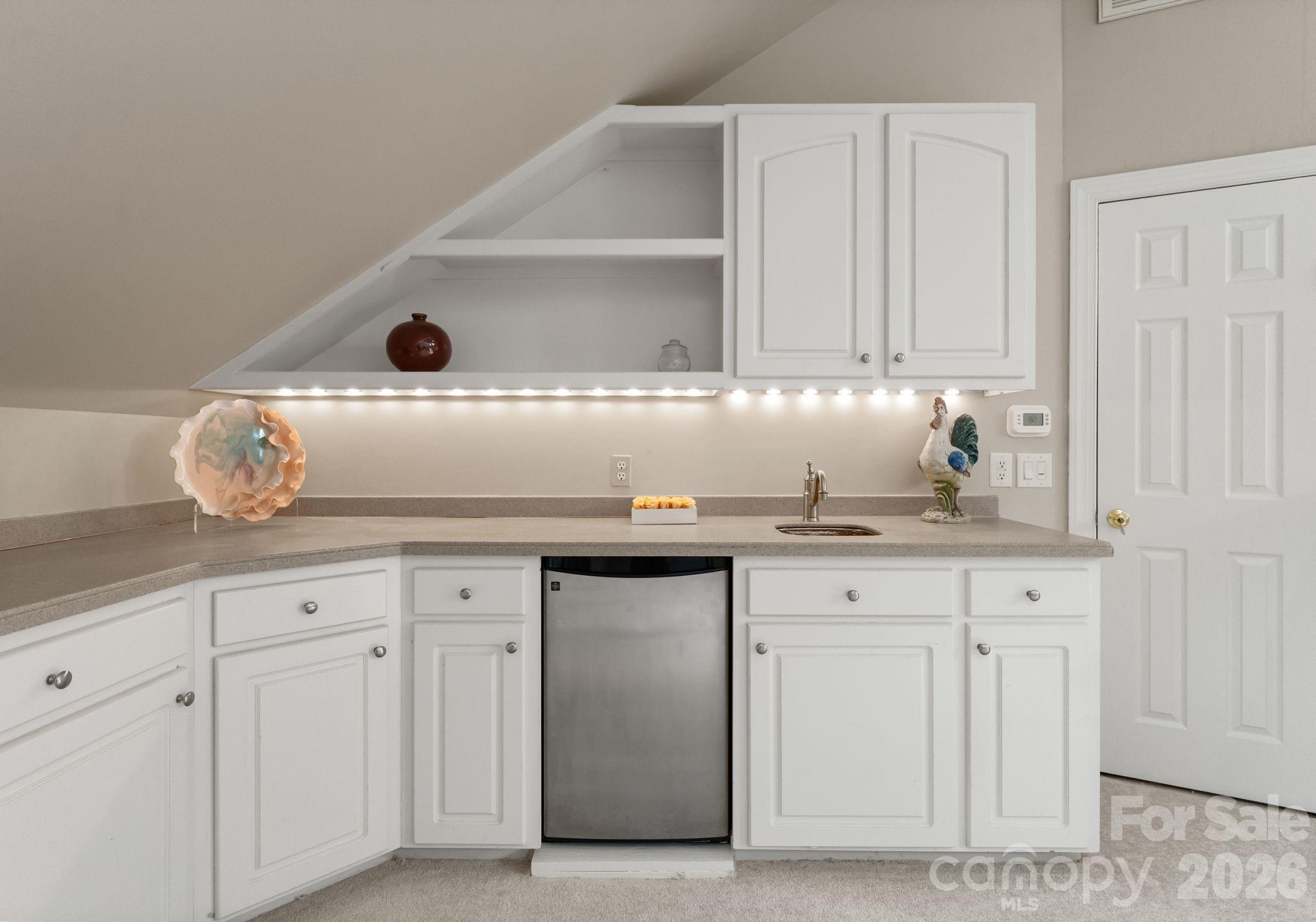 15705 Knox Hill Road Huntersville, NC 28078 - Photo 37 of 48 a kitchen with granite countertop a sink and cabinets