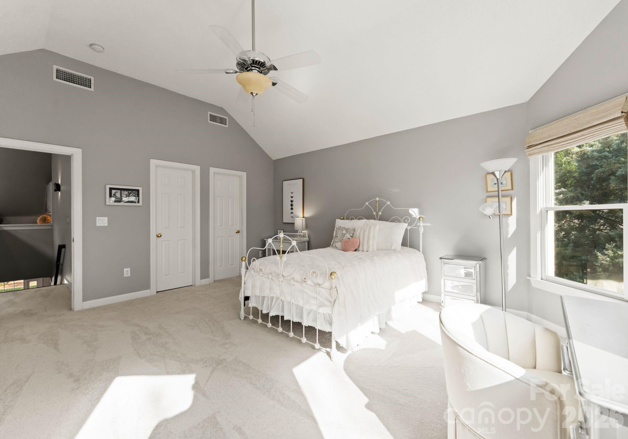 15705 Knox Hill Road Huntersville, NC 28078 - Photo 39 of 48 a spacious bedroom with a bed and a large window