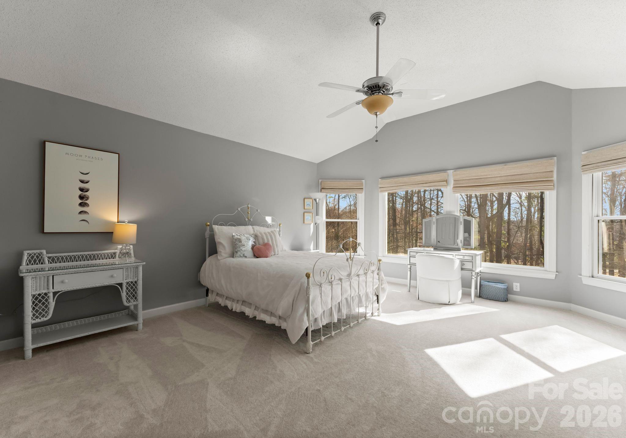 15705 Knox Hill Road Huntersville, NC 28078 - Photo 40 of 48 a bed room with furniture and a chandelier