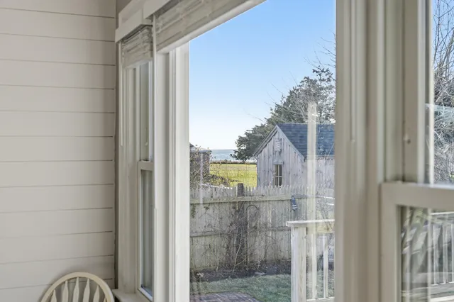 a view of a house with a wooden deck