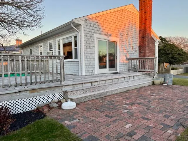 a view of a house with a yard and wooden floor