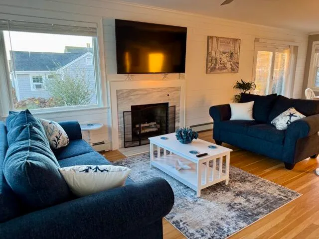 a living room with furniture and a fireplace