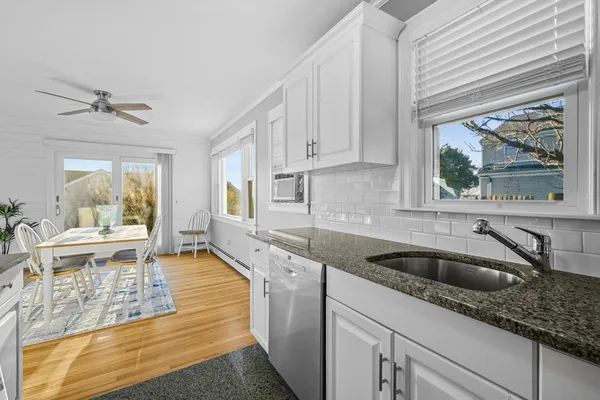 a view of a house with a wooden deck