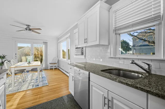 a view of a house with backyard porch and sitting area