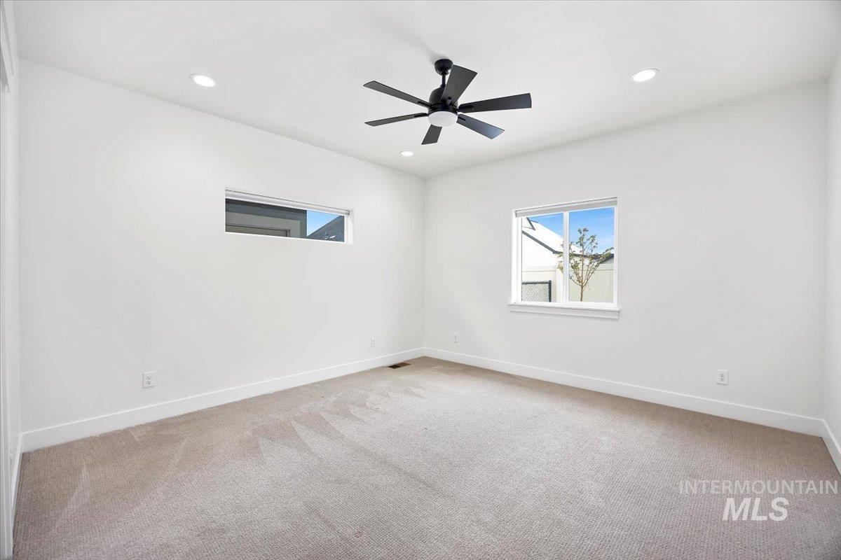 924 Trapper Peak Road Kimberly, ID 83341 - Photo 34 of 40 Spare room featuring light carpet, recessed lighting, and a ceiling fan