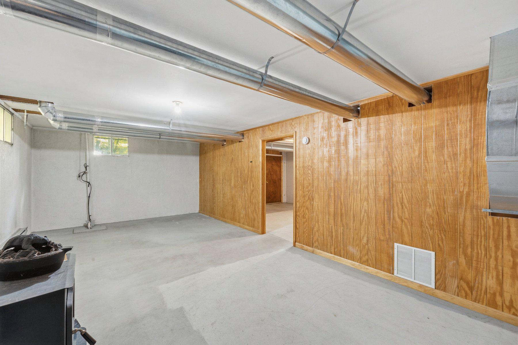 10820 Gambrill Park Road Frederick, MD 21702 - Photo 28 of 35 Improved basement with wood and pellet stoves