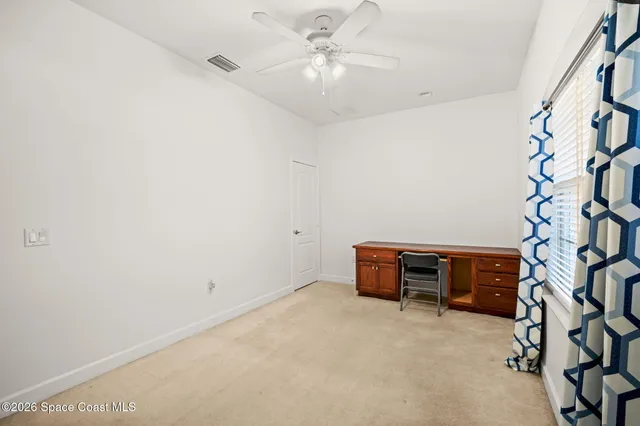 a view of a workspace with furniture