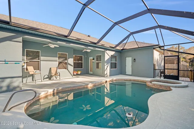 a view of a swimming pool with a patio