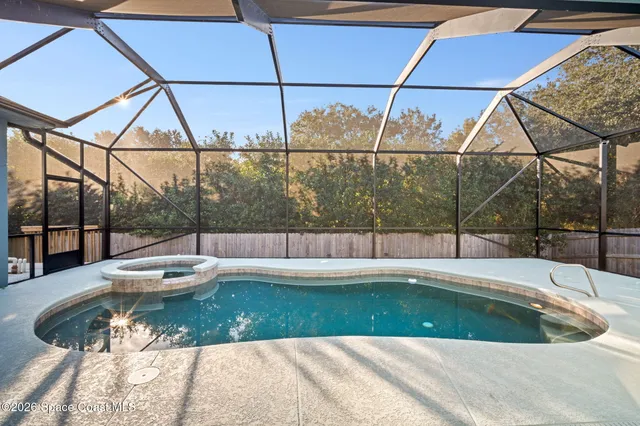 a view of a house with a swimming pool