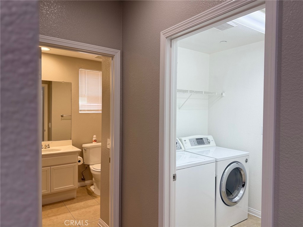 4547 Nicole Way Riverside, CA 92501 - Photo 12 of 36 a bathroom with a toilet and a sink