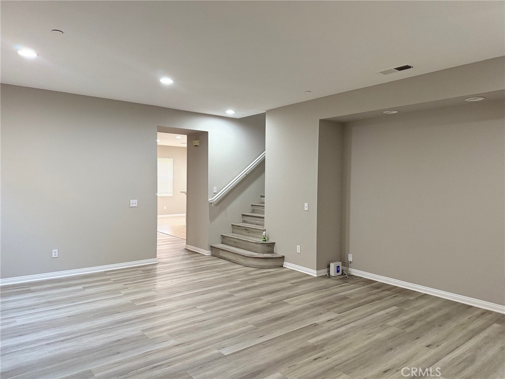 4547 Nicole Way Riverside, CA 92501 - Photo 2 of 36 an empty room with wooden floor and entryway