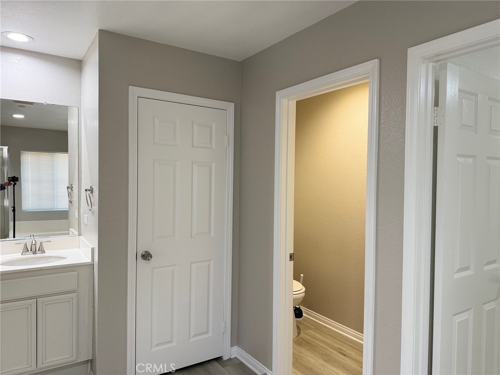 4547 Nicole Way Riverside, CA 92501 - Photo 25 of 36 a bathroom with a sink and a mirror