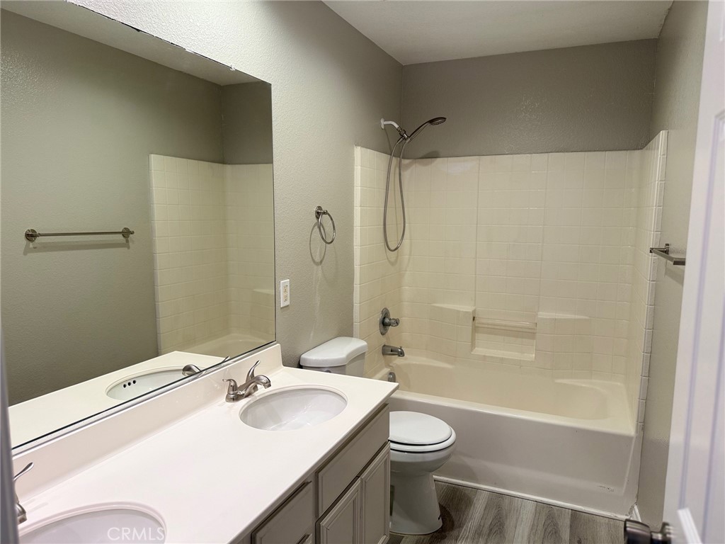 4547 Nicole Way Riverside, CA 92501 - Photo 34 of 36 a bathroom with a sink toilet and shower