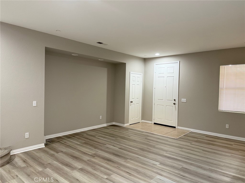 4547 Nicole Way Riverside, CA 92501 - Photo 4 of 36 a view of room with wooden floor