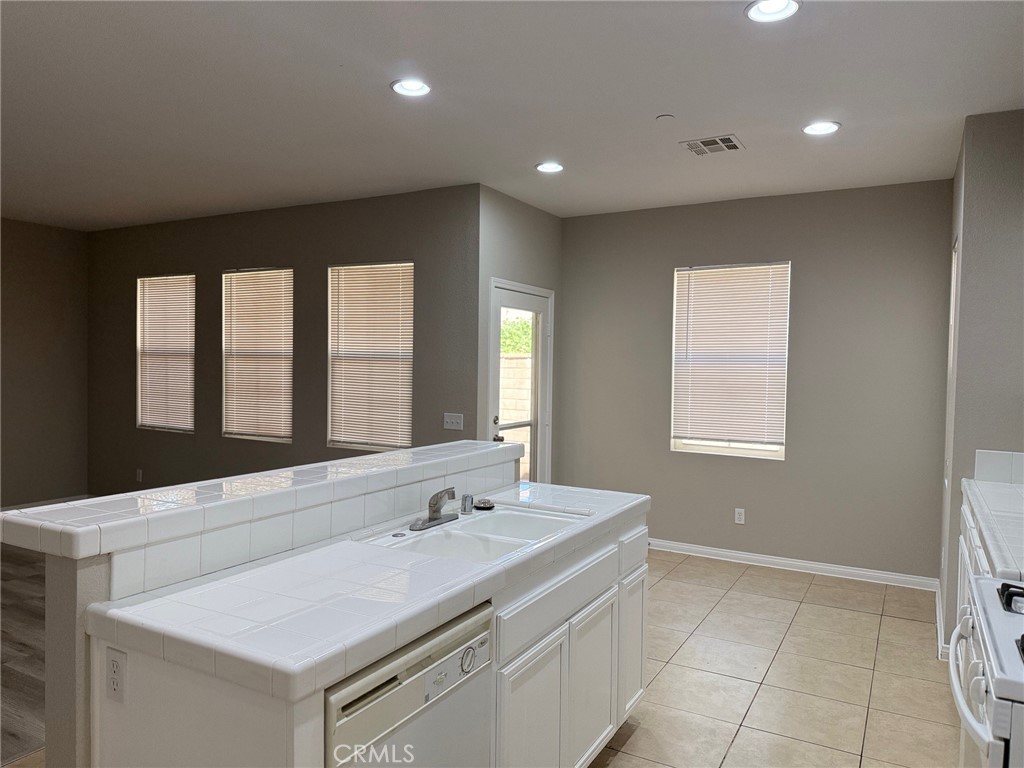 4547 Nicole Way Riverside, CA 92501 - Photo 9 of 36 a bathroom with a sink a vanity and a mirror
