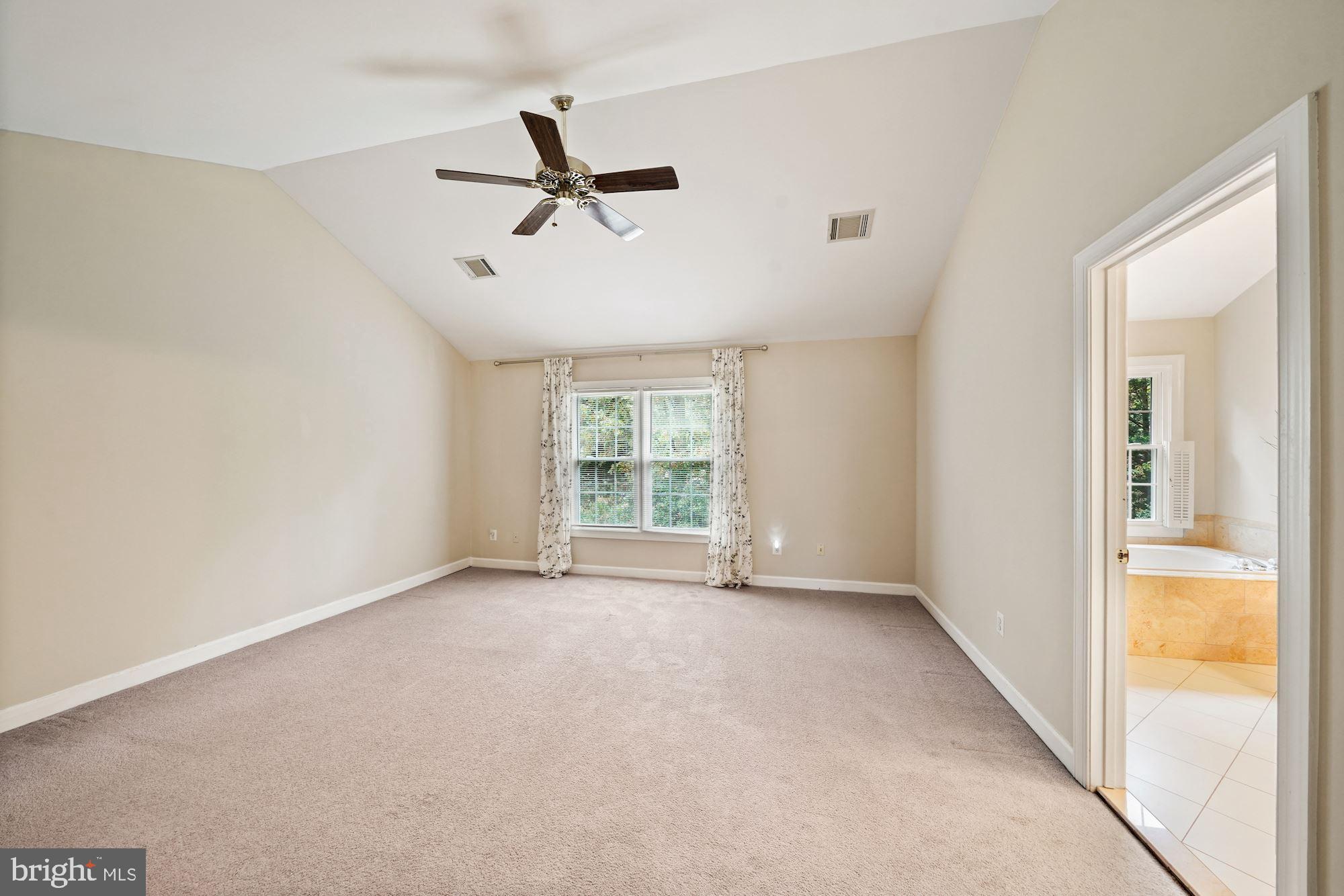 123 Roland Court Southwest Vienna, VA 22180 - Photo 18 of 34 Master bedroom suite with tall vaulted ceiling