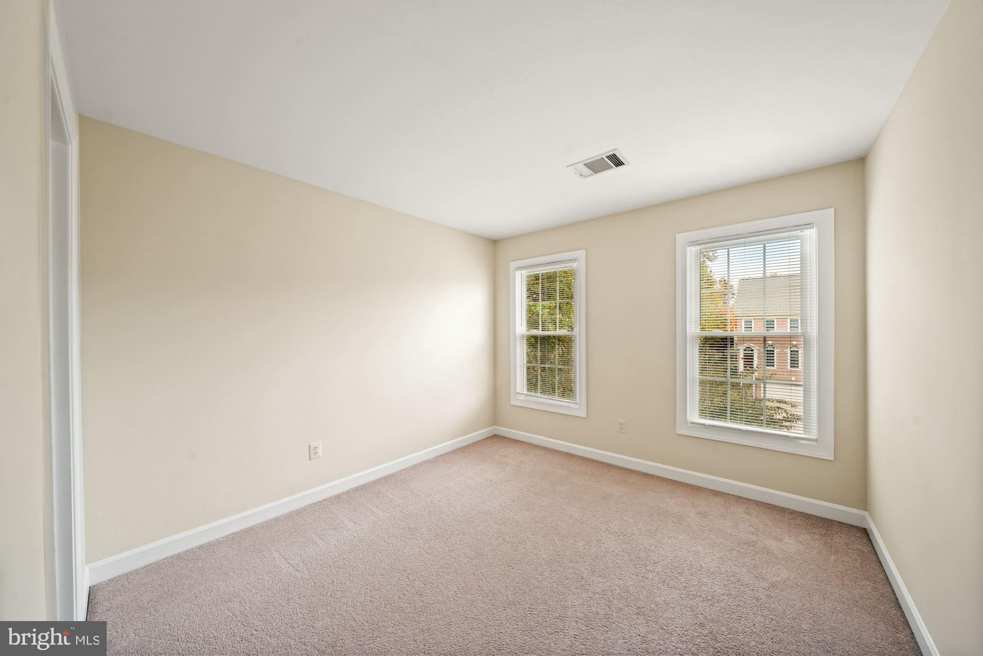 123 Roland Court Southwest Vienna, VA 22180 - Photo 25 of 34 Second and third bedrooms face front of townhome