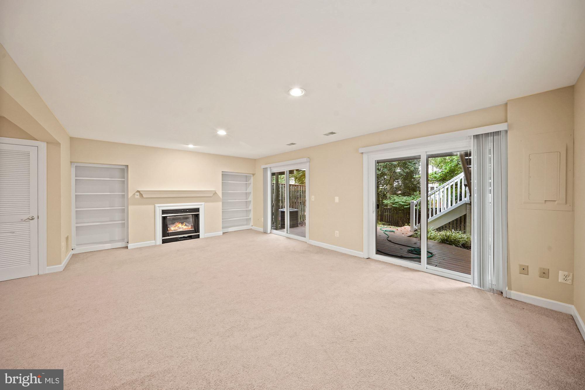 123 Roland Court Southwest Vienna, VA 22180 - Photo 28 of 34 Two large sliding doors lead to deck and garden