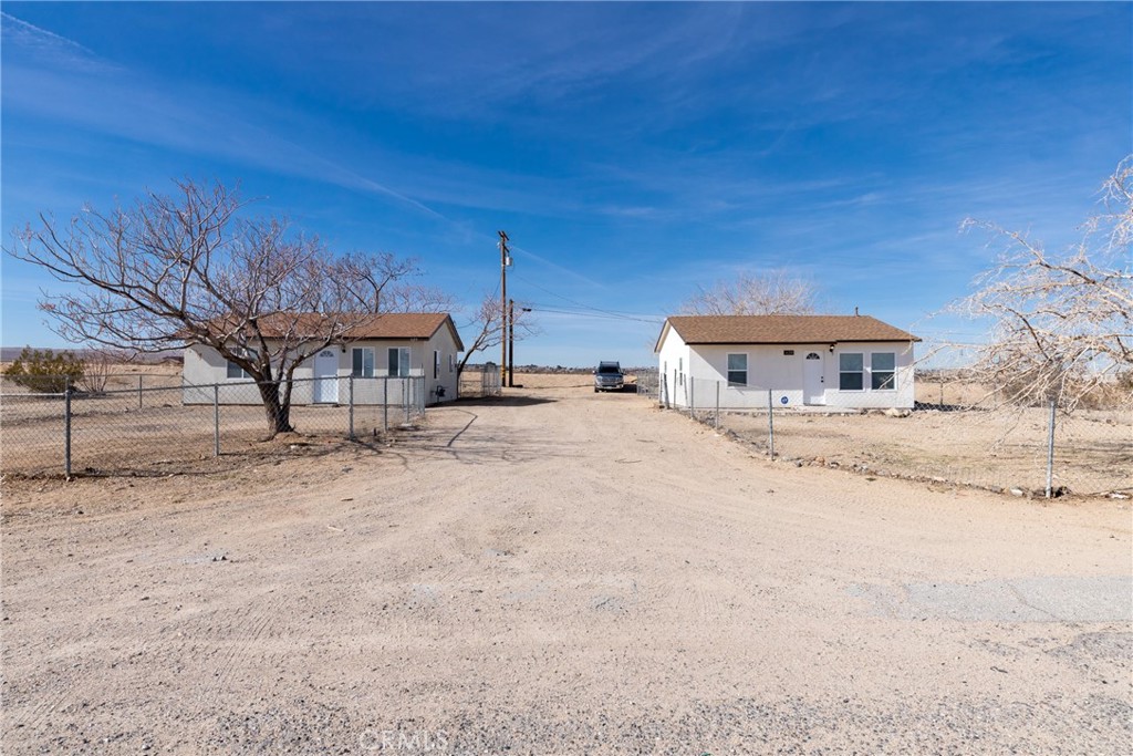 620 Colonial Drive Barstow, CA 92311 - Photo 1 of 1 a wooden bench sitting in middle of a yard