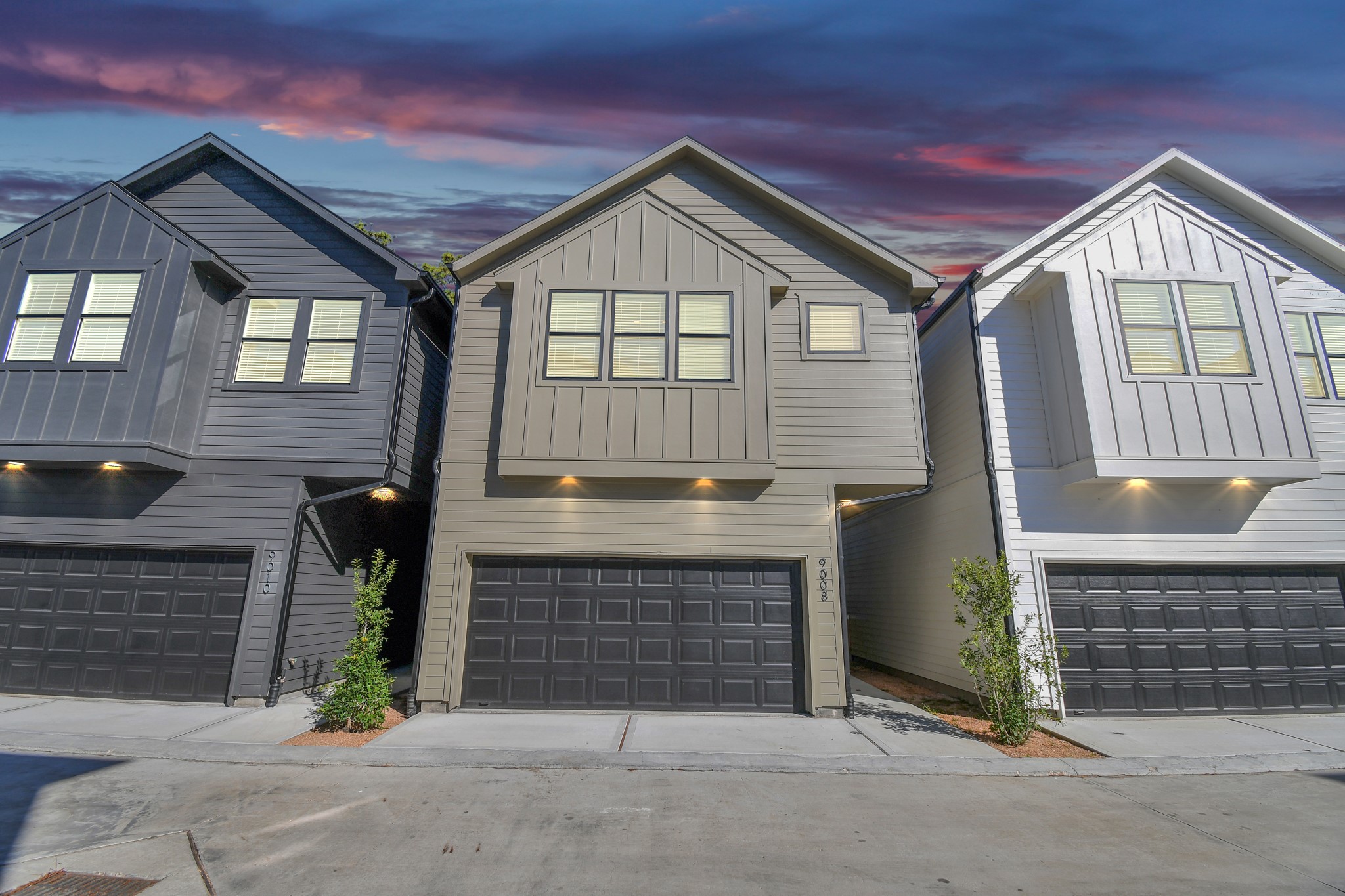 a front view of a house with garage