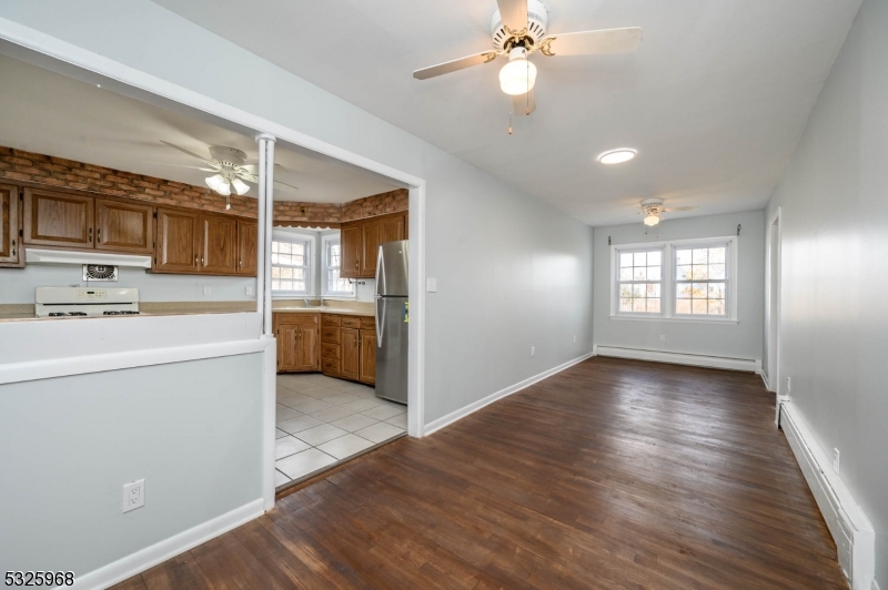 136 Valpeck Avenue, Unit 1 Raritan, NJ 08869 - Photo 14 of 37 a view of a kitchen with a sink dishwasher and a large window