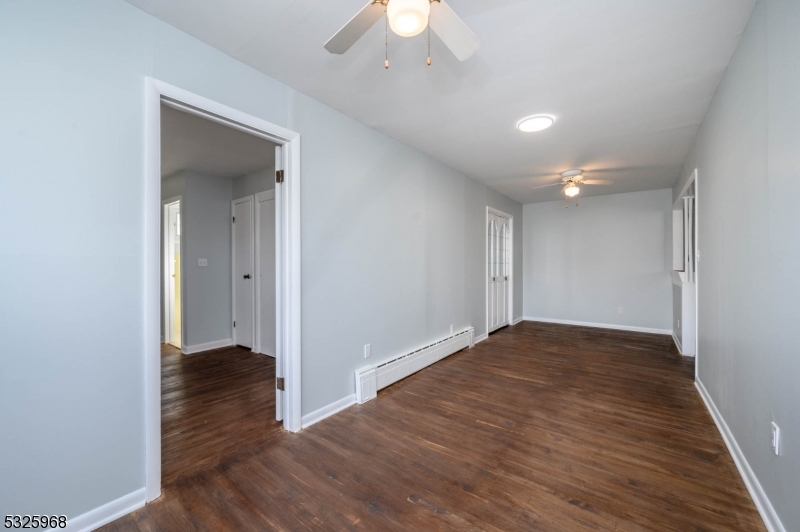 136 Valpeck Avenue, Unit 1 Raritan, NJ 08869 - Photo 15 of 37 wooden floor in an empty room with a window