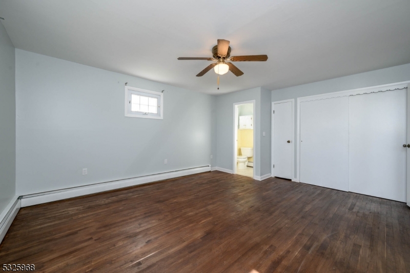 136 Valpeck Avenue, Unit 1 Raritan, NJ 08869 - Photo 17 of 37 a view of empty room with wooden floor and fan