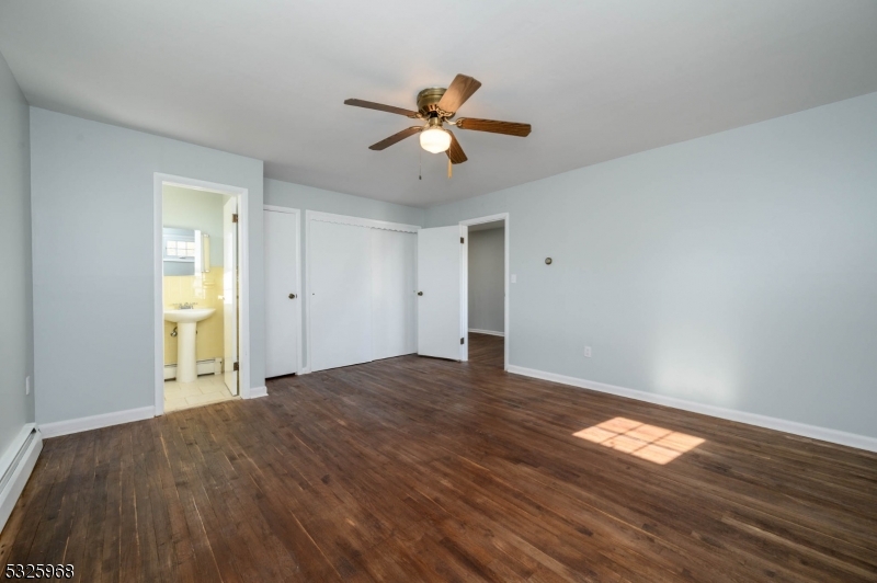 136 Valpeck Avenue, Unit 1 Raritan, NJ 08869 - Photo 18 of 37 a view of empty room with wooden floor