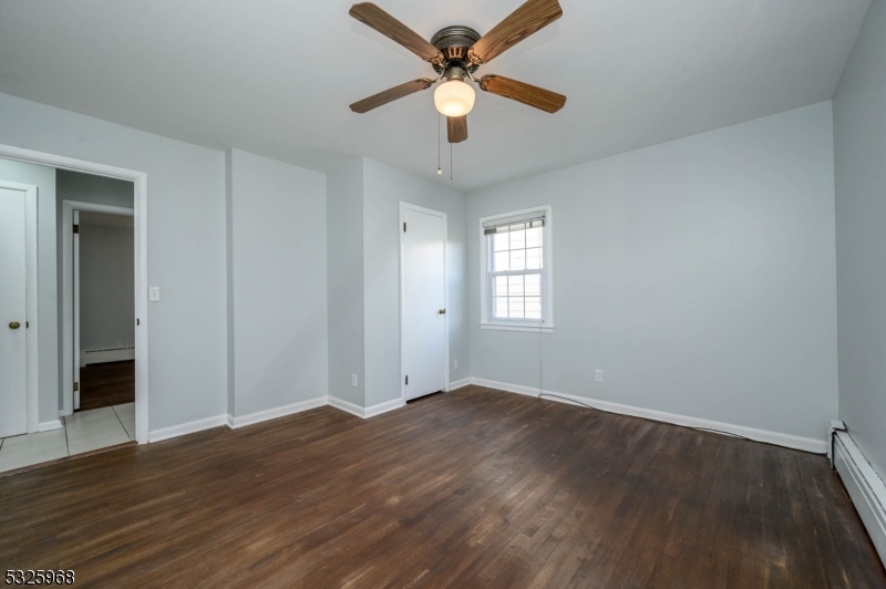 136 Valpeck Avenue, Unit 1 Raritan, NJ 08869 - Photo 22 of 37 wooden floor in an empty room with a window