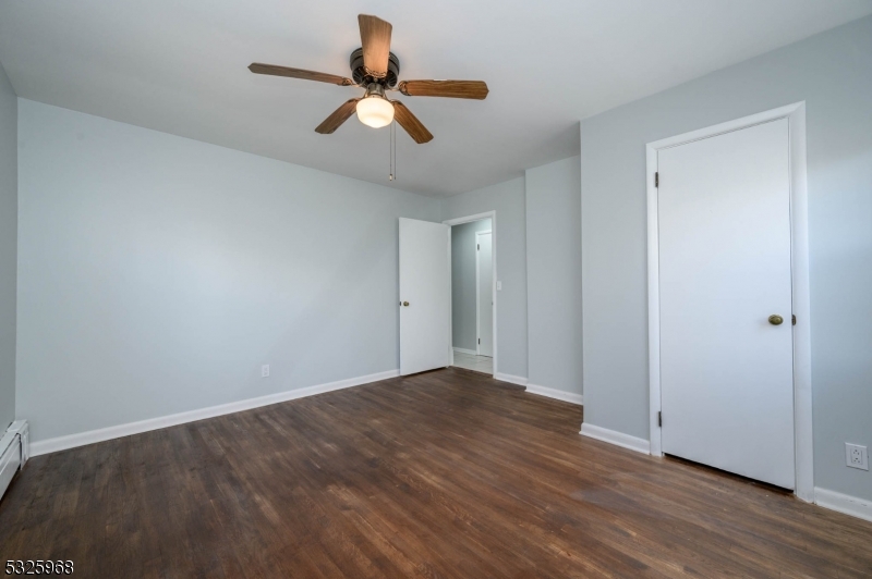 136 Valpeck Avenue, Unit 1 Raritan, NJ 08869 - Photo 23 of 37 a view of a room with wooden floor and windows